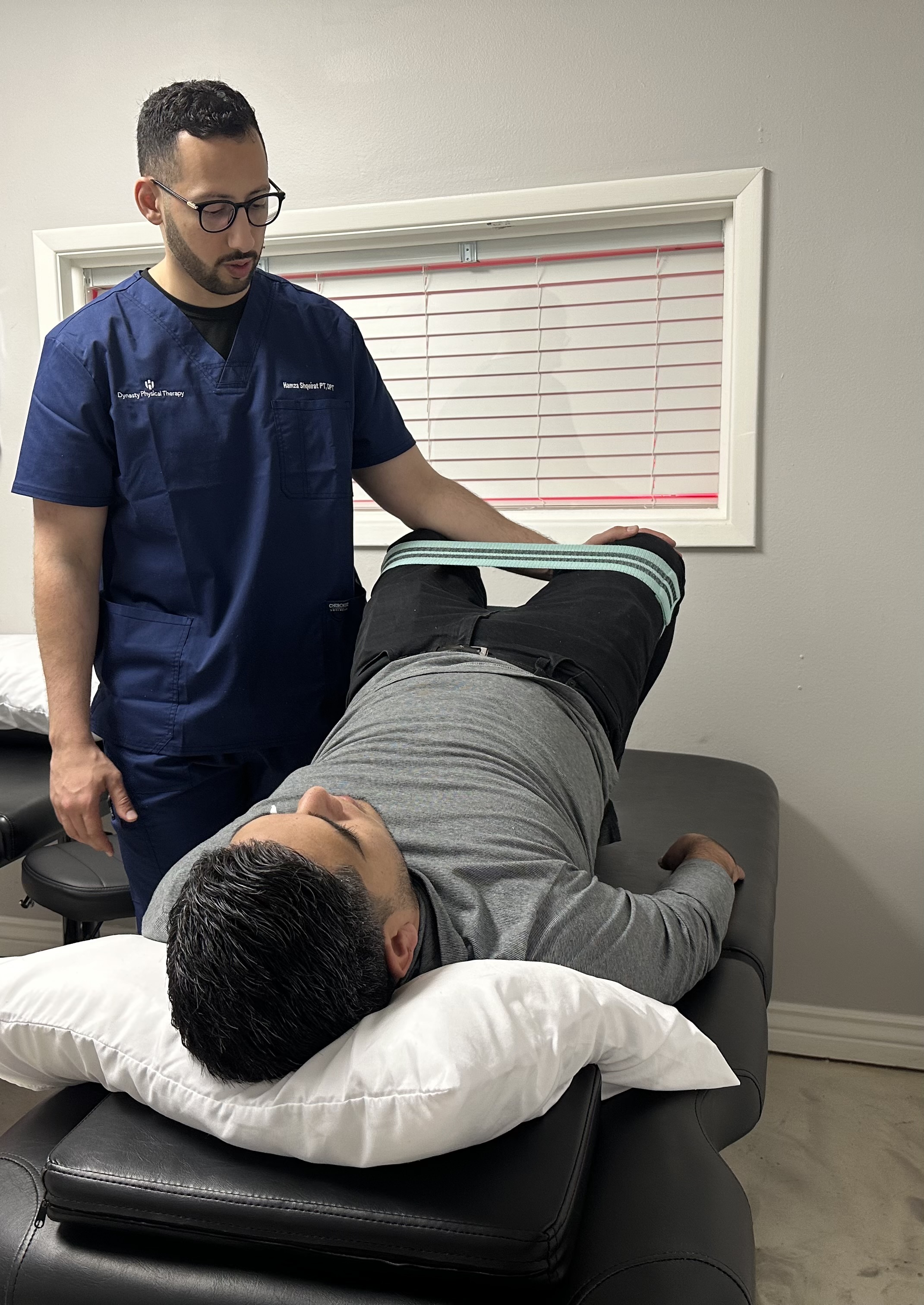 Physical therapist working with patient
